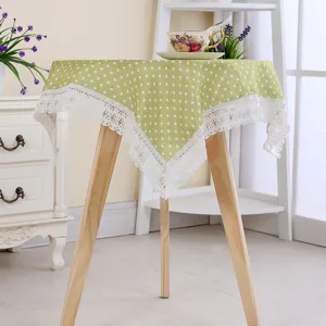 Green polka dot tablecloth with white lace trim, cotton linen square table cover for home decor.