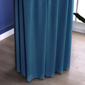 Detail shot of blue vertical air conditioner cover with elegant scalloped hem and drape.