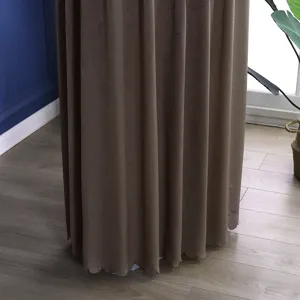 Detailed view of the brown vertical air conditioner dust cover with elegant scalloped hem.