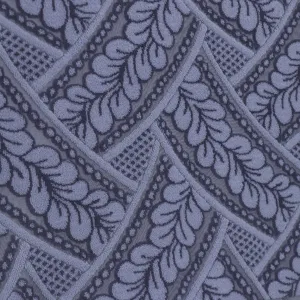 Detail view of purple lace dust cover fabric with leaf geometric patterns for home appliances.