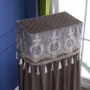Detailed view of the quilted standing air conditioner cover with elegant embroidery and tassels.