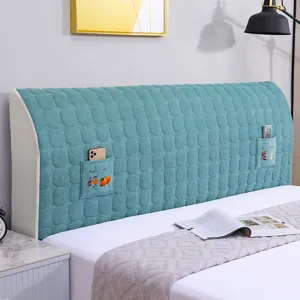 Quilted bed headboard cover dustproof full wrap slipcover with convenient side storage pockets.