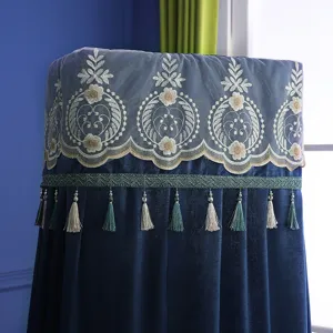 Detailed close-up of a luxury vertical air conditioner dust cover with blue velvet, lace, and tassels.