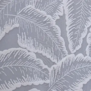 Close-up view of exquisite white leaf pattern lace fabric texture, soft sheer mesh detail.