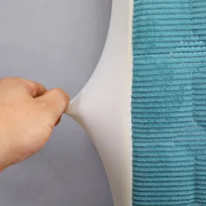 Thickened headboard cover detail showing stretchy white fabric and blue corduroy surface.