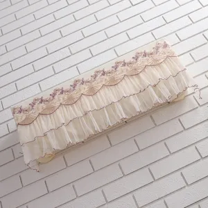 Detail view of the elegant beige mesh air conditioner dust cover with embroidered lace.