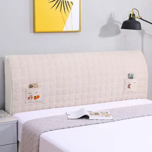 Detail view of quilted thickened bed headboard cover with storage pockets, dustproof and washable.