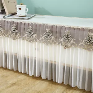 Elegante funda antipolvo de encaje para mueble TV con bordado floral muy delicado.