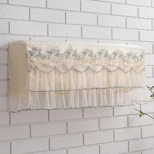 Detail view of hanging air conditioner dust cover with delicate floral embroidery and lace ruffles.
