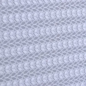 White lace fabric detail close-up showing delicate leaf mesh texture for home cover use
