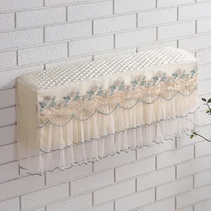Quilted wall-mounted air conditioner dust cover with delicate floral embroidery and lace.