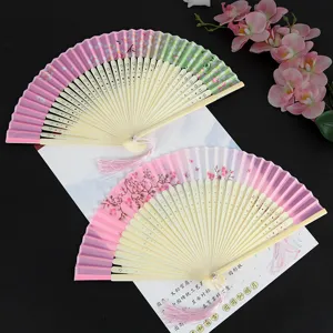 Chinese style folding hand fan with pink floral pattern and tassel for dance costume party