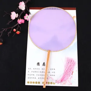 Detail view of traditional Chinese antique round fan with purple sheer fabric and elegant pink tassel.
