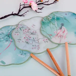 Traditional Chinese style translucent round fan with wooden handle, elegant floral art design.