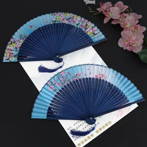 Traditional Chinese style folding fans with delicate floral print blue ribs and tassels for dance.