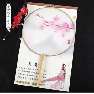 Traditional Chinese vintage round fan with wooden handle and translucent silk cherry blossom print.