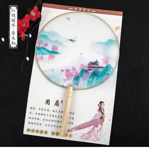 Traditional Chinese round fan with wooden handle, translucent silk fan surface for Hanfu photography.