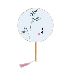 Traditional Chinese style round fan with wooden handle, silk material, elegant bamboo painting.