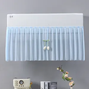 Cute bedroom air conditioner dust cover with blue pleated mesh curtain and tulip pendant.