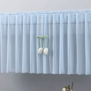 Light blue pleated air conditioner dust cover with cute tulip pendant for bedroom decor.