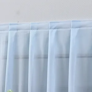 Detailed close-up of the light blue sheer air conditioner wind shield curtain top pleat design.