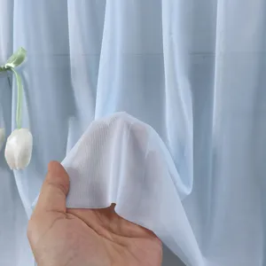 Light blue sheer mesh air conditioner wind baffle detail, soft breathable fabric texture.