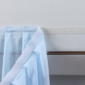 Detail view of a light blue air conditioner windshield curtain featuring secure Velcro design.