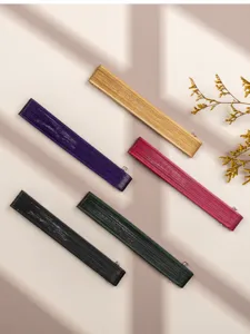 Detailed view of mini folding bamboo hand fans in five vibrant colors, nicely arranged for a classic style.
