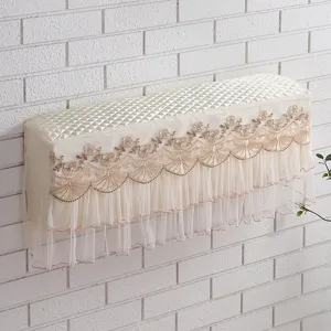Wall-mounted AC dust cover with elegant embroidery lace and quilted top for home decor details.