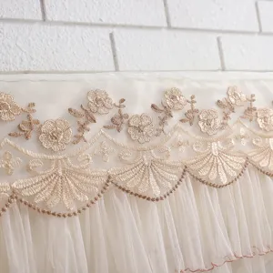 Detailed view of elegant lace embroidery hanging air conditioner dust cover for home use.