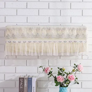 Close-up of beige lace embroidered air conditioner dust cover with elegant mesh fringe.