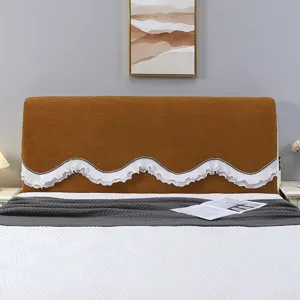 Detailed view of brown velvet headboard cover with white ruffled lace trim in cozy bedroom.