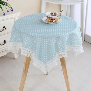 Beautiful blue polka dot tablecloth with white lace trim for round table home decor.