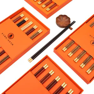 Premium Chinese style wooden chopstick gift set with elegant orange presentation boxes for home use.