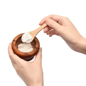 Small unpainted wooden spoon and mini mortar set for honey condiment and dessert use.