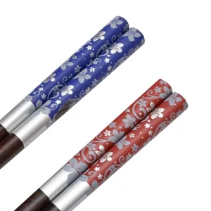 Japanese style wooden chopsticks set with floral pattern and pointed tips for kitchen use.