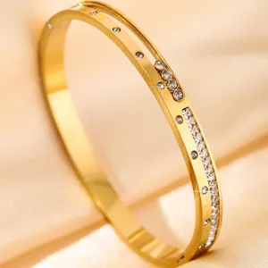 Gold stainless steel crystal embedded bangle bracelet fine detail close up jewelry accessory