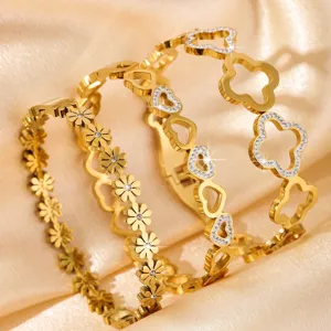 Gold stainless steel bracelets set featuring clover heart and flower designs for women fashion.
