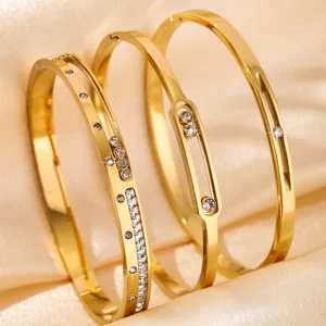 Gold titanium steel triple bangle bracelet set with sparkling cubic zirconia fashion jewelry.
