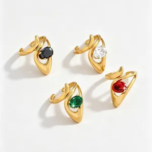 Gold stainless steel open rings set with sparkling black white green and red oval cubic zirconia stones.