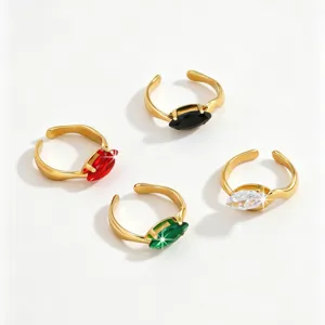 Detail shot of stylish 18k gold plated stainless steel open rings with colorful cubic zirconia.