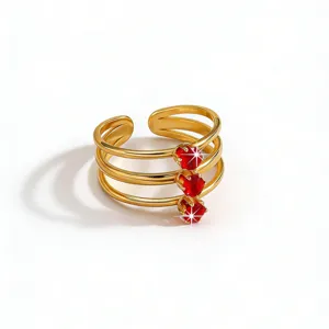 Detailed view of the retro style multi-layer open gold ring featuring sparkling red cubic zirconia.
