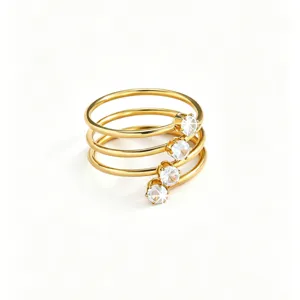 Detailed closeup of multi-layer gold ring sparkling zirconia crystal luxury stackable design