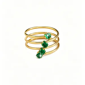 Gold multi-loop spiral ring featuring vibrant green zircon stones, elegant and chic finger jewelry for women.