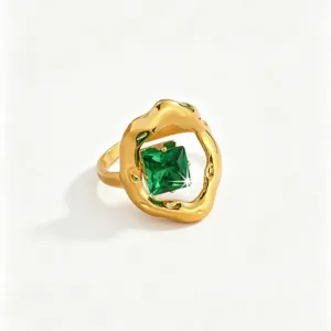 Detailed view of the luxury stainless steel green zircon gold ring, elegant women jewelry.