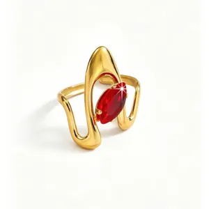 Detail shot of a stylish gold-tone stainless steel ring featuring an eye-catching red marquise zircon stone.
