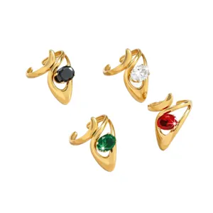 Gold open rings with curved designs featuring black, white, green and red oval zircon stones.