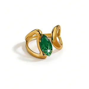Detailed view of gold plated open ring featuring a stunning marquise cut green zircon stone.