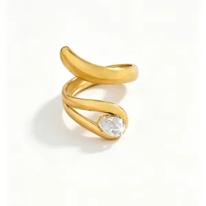 Close-up detail of the 18k gold plated open wrap ring featuring a sparkling pear-cut cubic zirconia.
