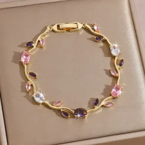 Exquisite gold-plated leaf branch bracelet featuring sparkling colorful cubic zirconia stones.